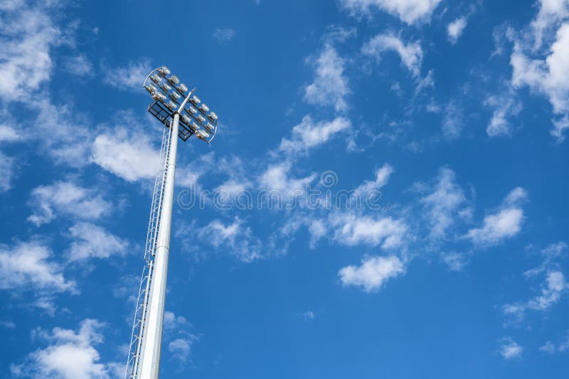 Close up vief of a floodlight in a professional sportsfield. with daylight cloudy blue sky. stock images Close up vief of a floodlight in a professional sportsfield. with daylight cloudy blue sky. stock images