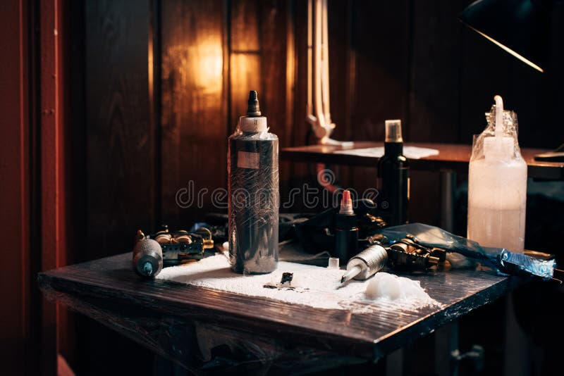 Close Up View of Arranged Tattoo Machines and Paint Stock Image Image