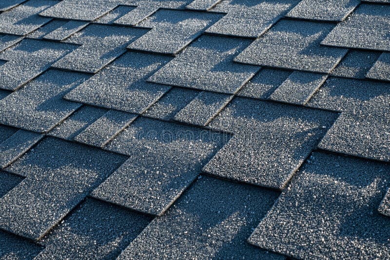 Close Up View on Asphalt Roofing Shingles Covered with Frost. Stock