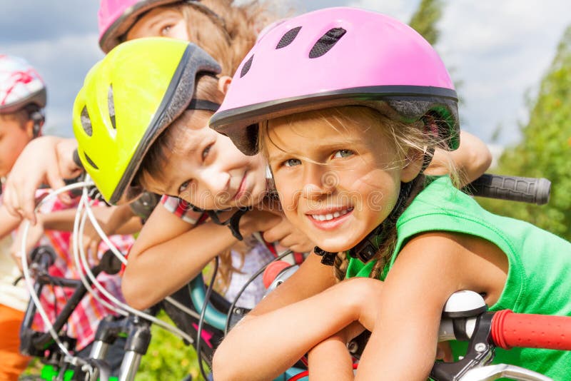 Close up view of blond girl and boy in helmet