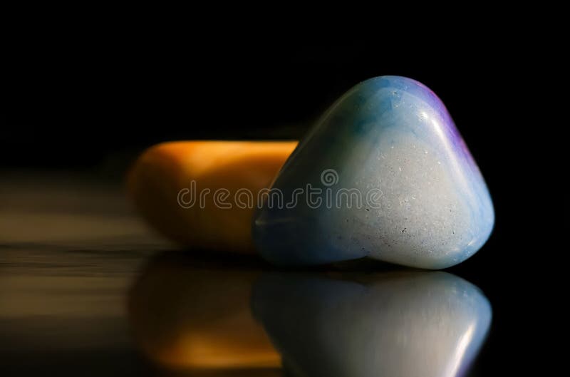 Close Up View of Blue and Yellow Gem Stones Stock Image Image of mineral, hand 256361703