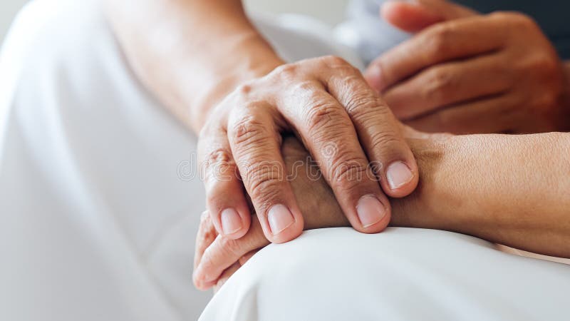 Close up view of caring elderly grandma wife holding hand supporting royalty free stock photos