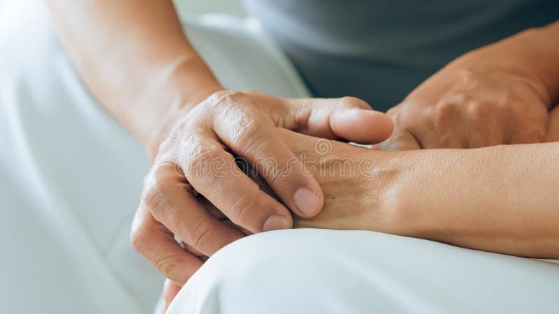 Close up view of caring elderly grandma wife holding hand supporting senior grandpa husband give empathy care love royalty free stock images