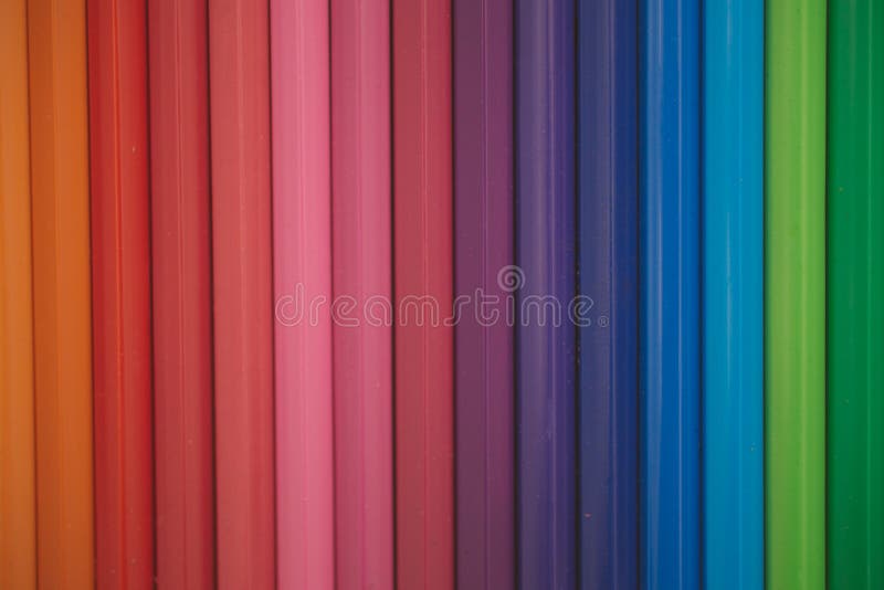 Close up view of colored pencils as background for design.