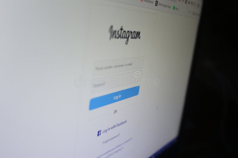 Instagram Login Page on Screen. A close-up view of a computer screen displaying the Instagram login page. The interface includes fields for entering a phone number, username, or email along with a password. The blue "Log in" button is prominently visible. This image represents digital connectivity, social media interaction, and online account access.