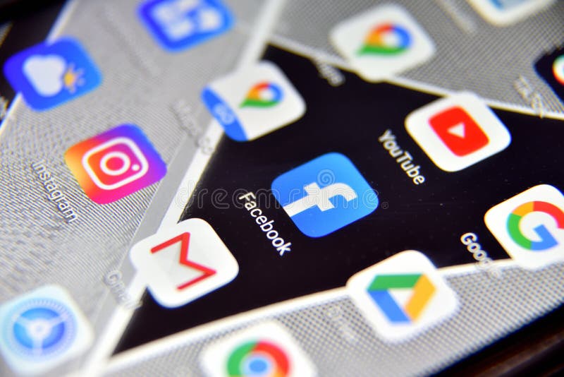 Close-up view of Facebook icon app on an Android smartphone, including other icons stock photos