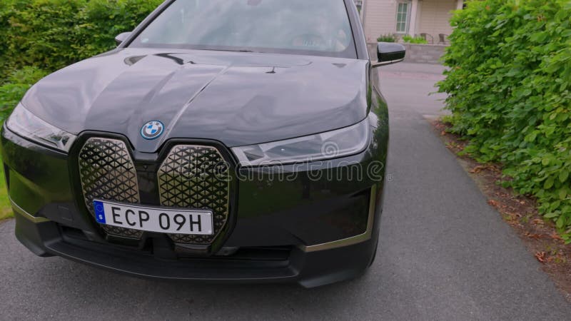 Close up view front BMW IX40 black car electric model. stock footage