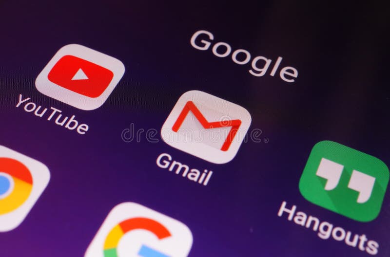 Close-up view of Google apps on an Android smartphone, including Gmail, YouTube, Hangouts stock image