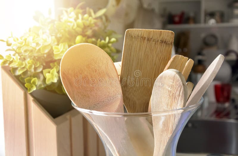 Closeup View of a Group of Wooden Kitchen Utensils Inside a Glass