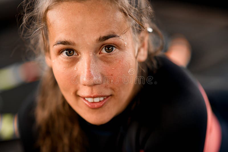 Close-up view of handsome woman`s face with brown hair and brown color eyes