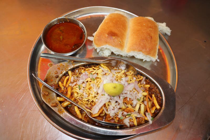 Close up view of indian street food in Mumbai- Misal Pav. Close up view of indian street food in Mumbai. Maharastra fast food- missal pav stock photo Close up view of indian street food in Mumbai- Misal Pav. Close up view of indian street food in Mumbai. Maharastra fast food- missal pav stock photo