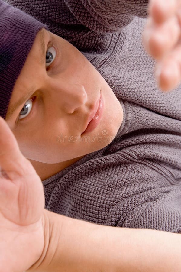 Close up view of man s face posing with open palm