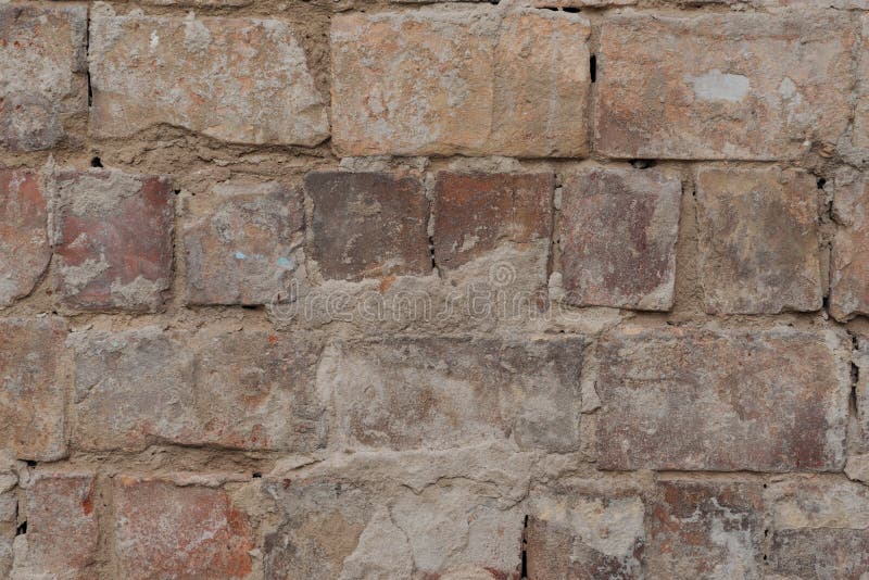 Close up view of old cracked brick wall textured stock photography