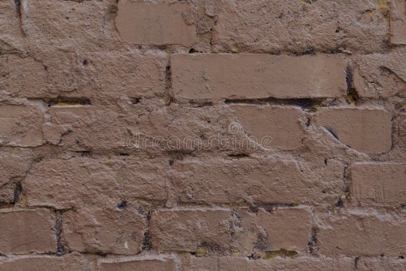 Close up view of old cracked brown brick wall textured background stock image