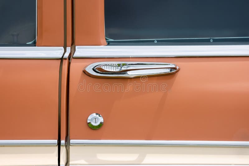 Close up view of vintage car with chrome door handle