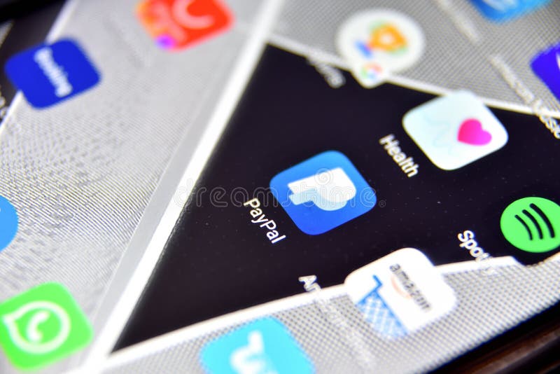 Close-up view of PayPal icon app on an Android smartphone, including other icons royalty free stock image
