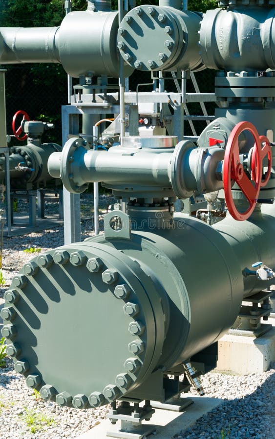 Intricate system of metal pipes and valves and wheels used to regulate water and sewage stock image