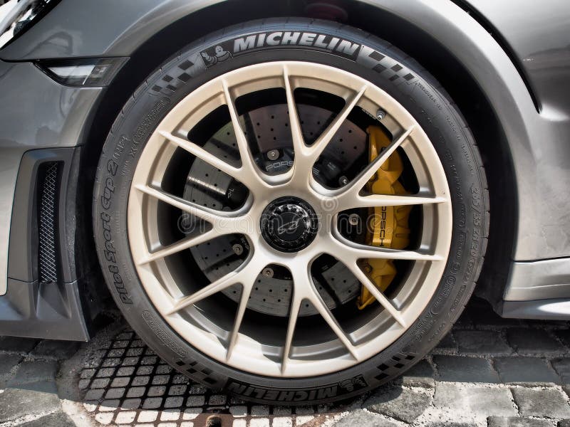 Closeup View of Porschefront Wheel with Brakes Editorial Image