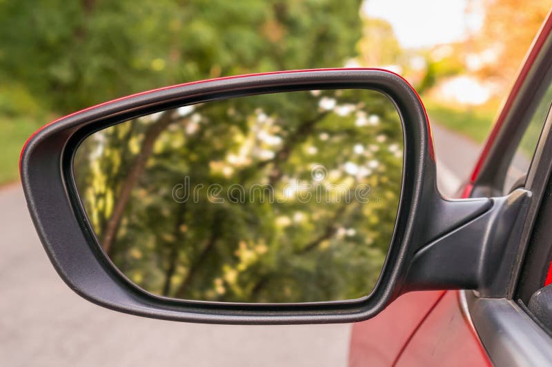 Close-up view of rearview mirror on the car