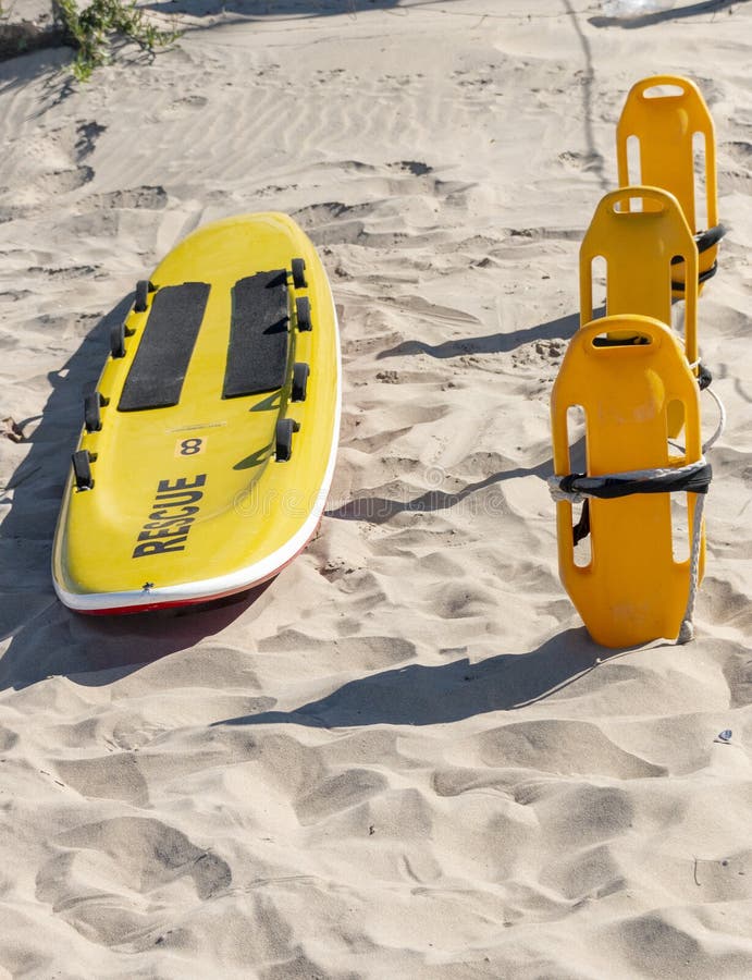 Close Up of Lifesavers and Rescue Surfboard on the Sand Stock Image ...