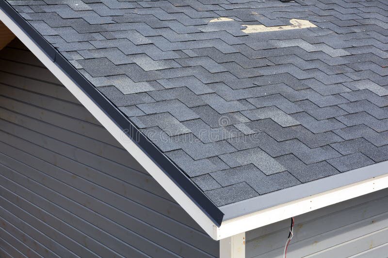 A close up view of shingles a roof damage. Roof Shingles - Roofing. royalty free stock image A close up view of shingles a roof damage. Roof Shingles - Roofing. royalty free stock image