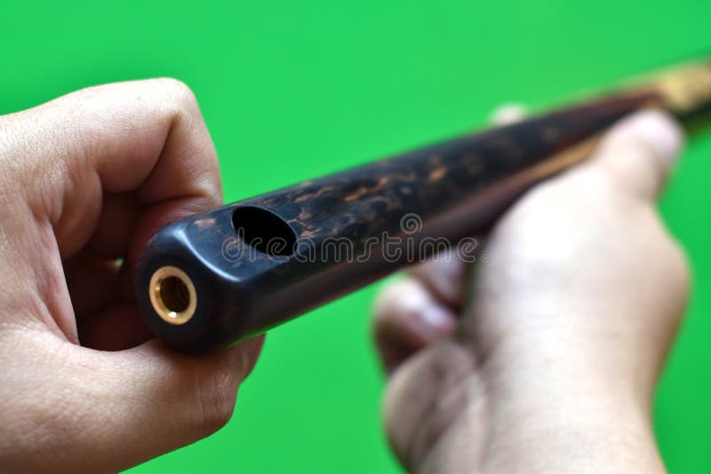 Closeup View, Snooker Cue Stick in Holding Hand. Stock Photo Image