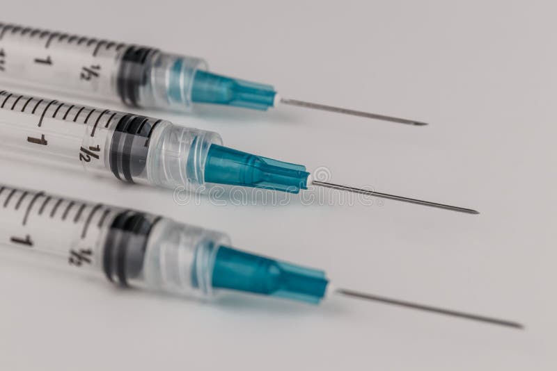 Close up view of a three syringes with hypodermic needles. Opiate and heroin overdoses have skyrocketed in recent years V