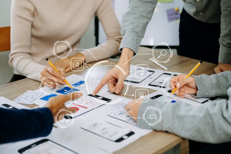 Close up view of UI developer team brainstorming on their project with laptop, smartphone and digital tablet. Creative digital royalty free stock photography