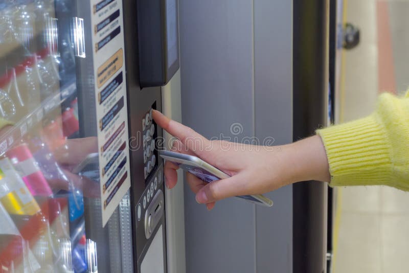 hand pushing button of vending coffee machine