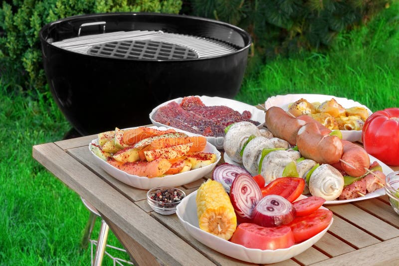 Close-up View On Wood Picnic Table With Different Cookout Food