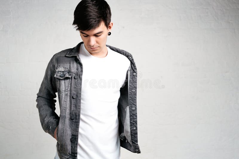 Close up view of young man wearing white t-shirt and jacket royalty free stock photo Close up view of young man wearing white t-shirt and jacket royalty free stock photo