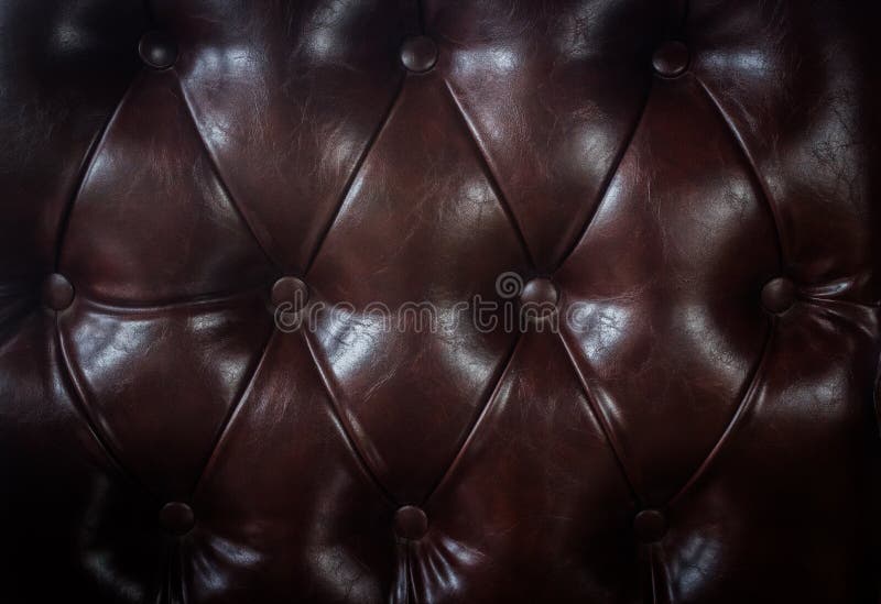 Close up vintage brown leather of sofa texture background stock photo