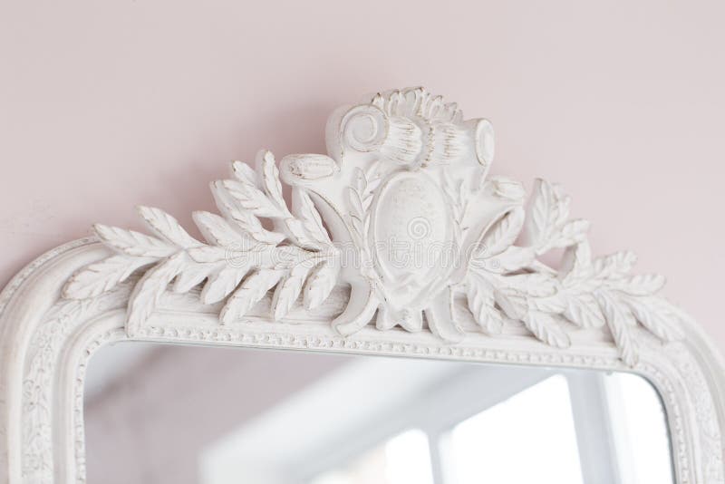 Close-up of a vintage mirror with decorative ornaments stock photo Close-up of a vintage mirror with decorative ornaments stock photo