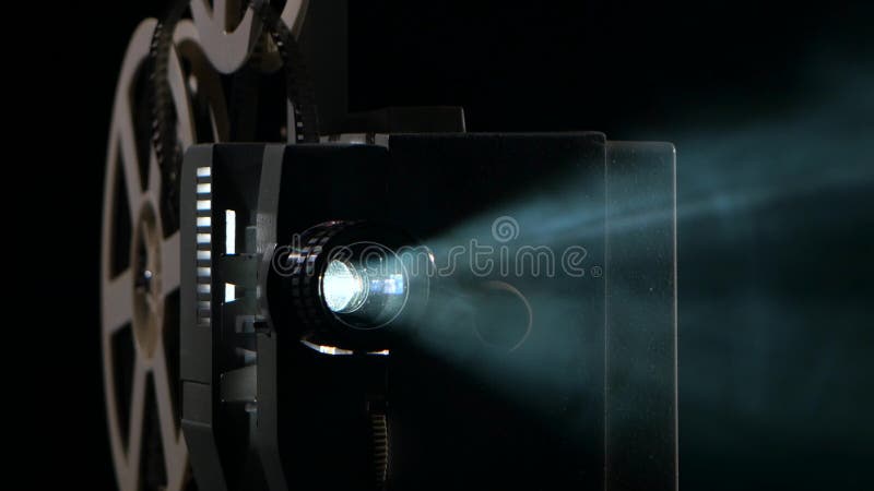 Close up of a vintage movie projector. Projection rays