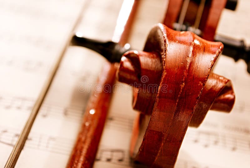 Close Up of Violin Scroll and Bow royalty free stock photo