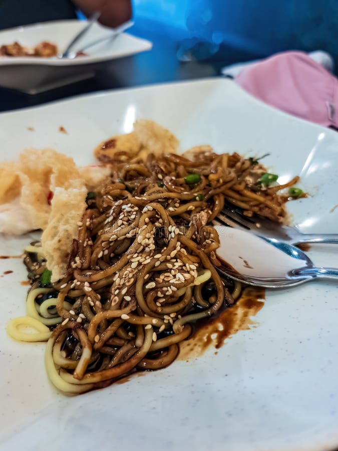 Close Up of the Wantan Noodle with Fried Bean Curd and Sesame Stock