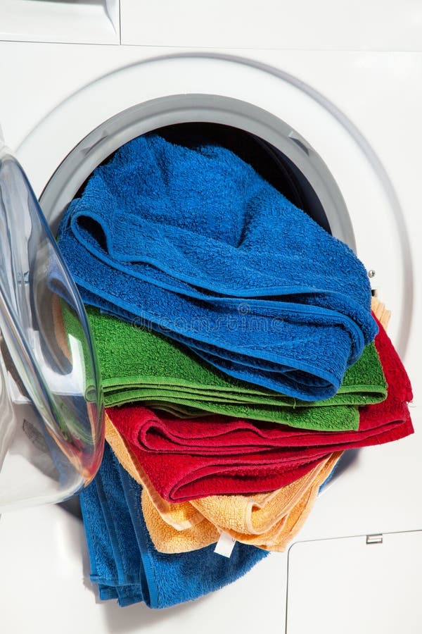 Close Up Of A Washing Machine Loaded With Clothes Stock Photo Image