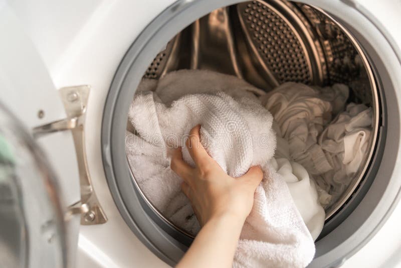 Close Up Of A Washing Machine Loaded With Clothes Stock Photo - Image ...