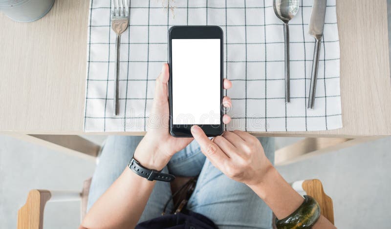 Close up white blank screen mobile over restaurant table order food online royalty free stock photo Close up white blank screen mobile over restaurant table order food online royalty free stock photo