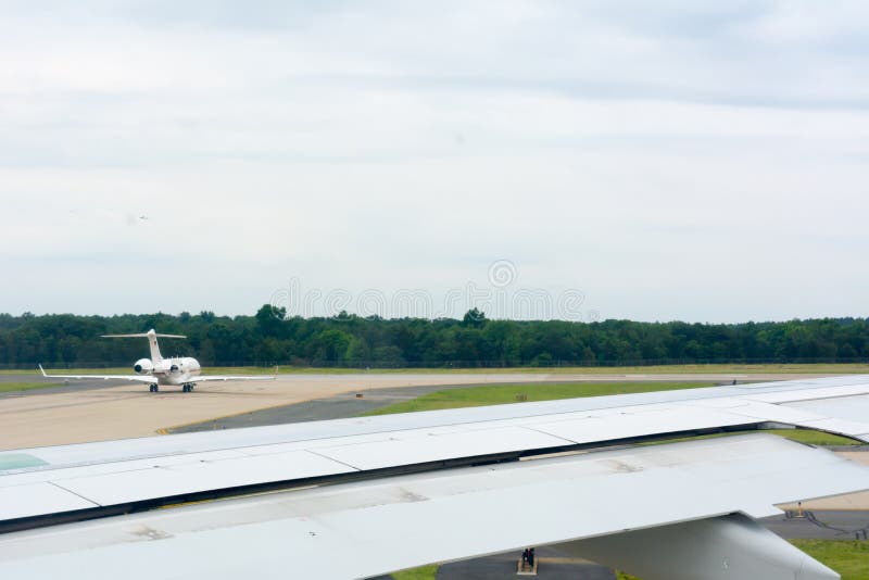 Close Up of Wing of an Airplane on another Airplane during Take Off Operations Background royalty free stock photography Close Up of Wing of an Airplane on another Airplane during Take Off Operations Background royalty free stock photography