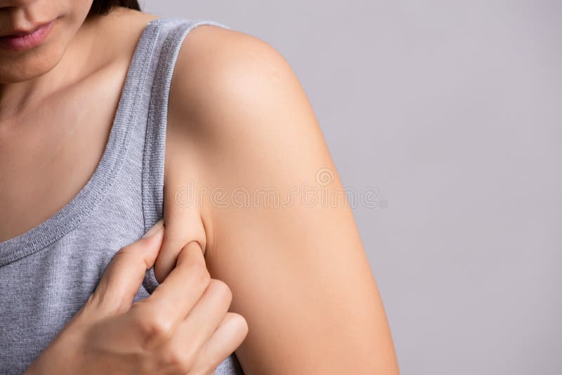 Close up woman pulling her skin underarm. problem armpit fat skin concept. Problem wrinkle stock images, royalty-free photos and pictures