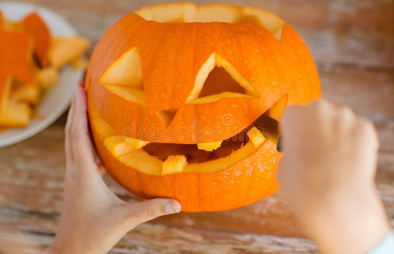 Close up of woman with pumpkins at home