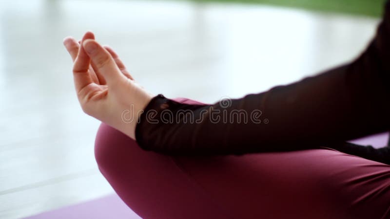 Hand detail of a girl meditation and taking yoga poses at sunset under  trees Stock Photo - Alamy