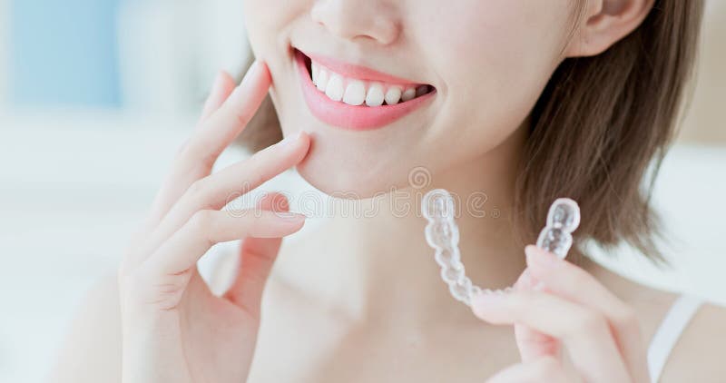 Woman take invisible braces stock photos Woman take invisible braces stock photos