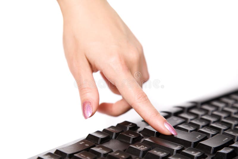 Close-up of womanï¿½s hand touching computer keys