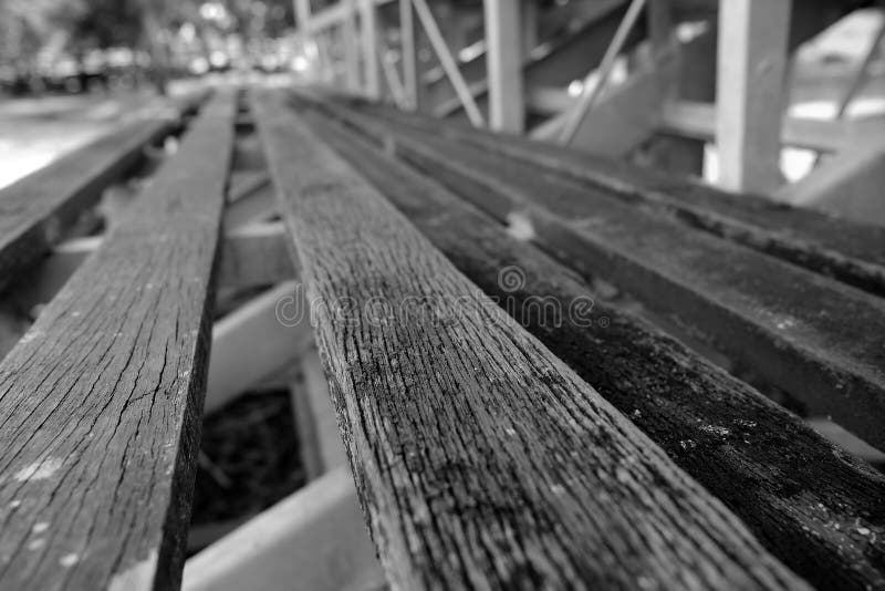 Close up Wood Stadium Seats in Black and White Tone. Selective Focus