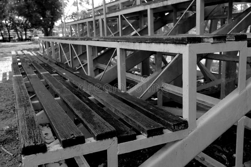 Close up Wood Stadium Seats in Black and White Tone. Selective Focus