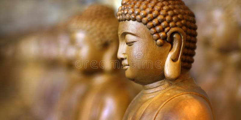 Close up of wooden statue of buddha