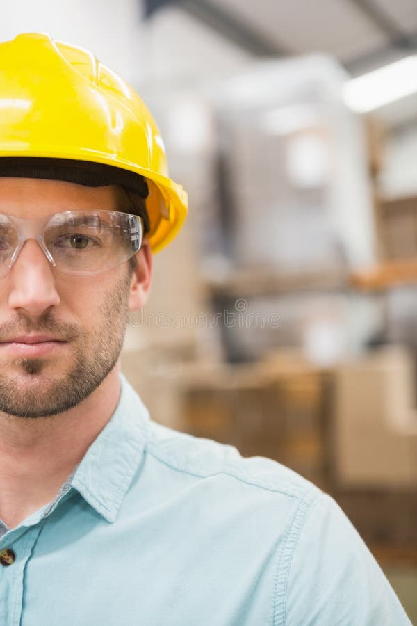 Close Up of Worker Wearing Hard Hat in Warehouse Stock Photo Image of