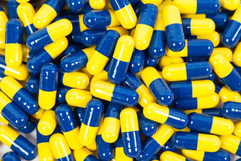 Close Up Yellow and Blue Capsule Stock Photo Image of blister, glass